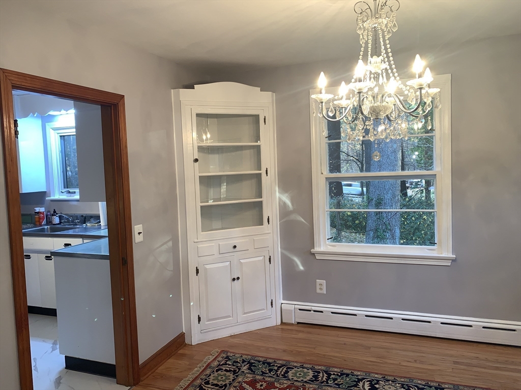 124 Brimfield Road Monson, MA 01057 - Photo 17 of 36 a view of empty room with window and wooden floor
