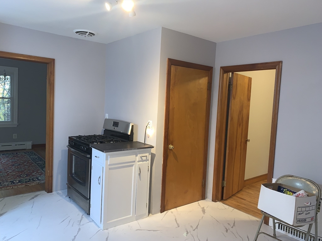 124 Brimfield Road Monson, MA 01057 - Photo 18 of 36 a bedroom with a bed and a chair