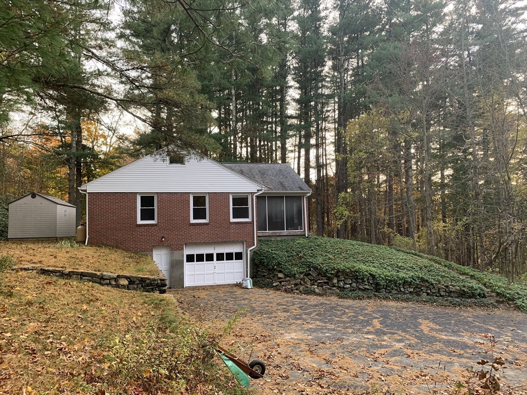 124 Brimfield Road Monson, MA 01057 - Photo 4 of 36 a front view of a house with a yard