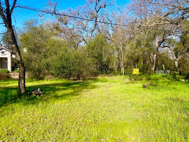 a view of a yard with swimming pool