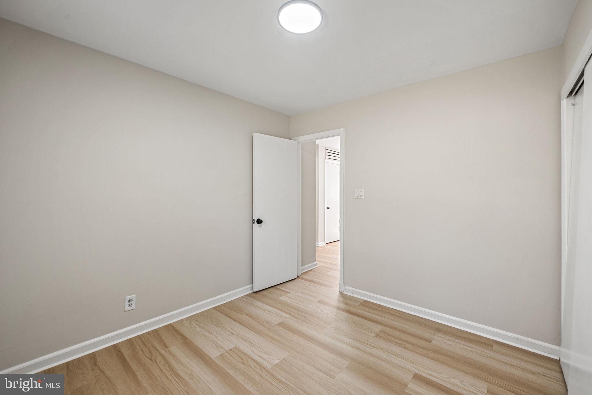 1513 Flora Lane Silver Spring, MD 20910 - Photo 25 of 49 a view of an empty room with wooden floor