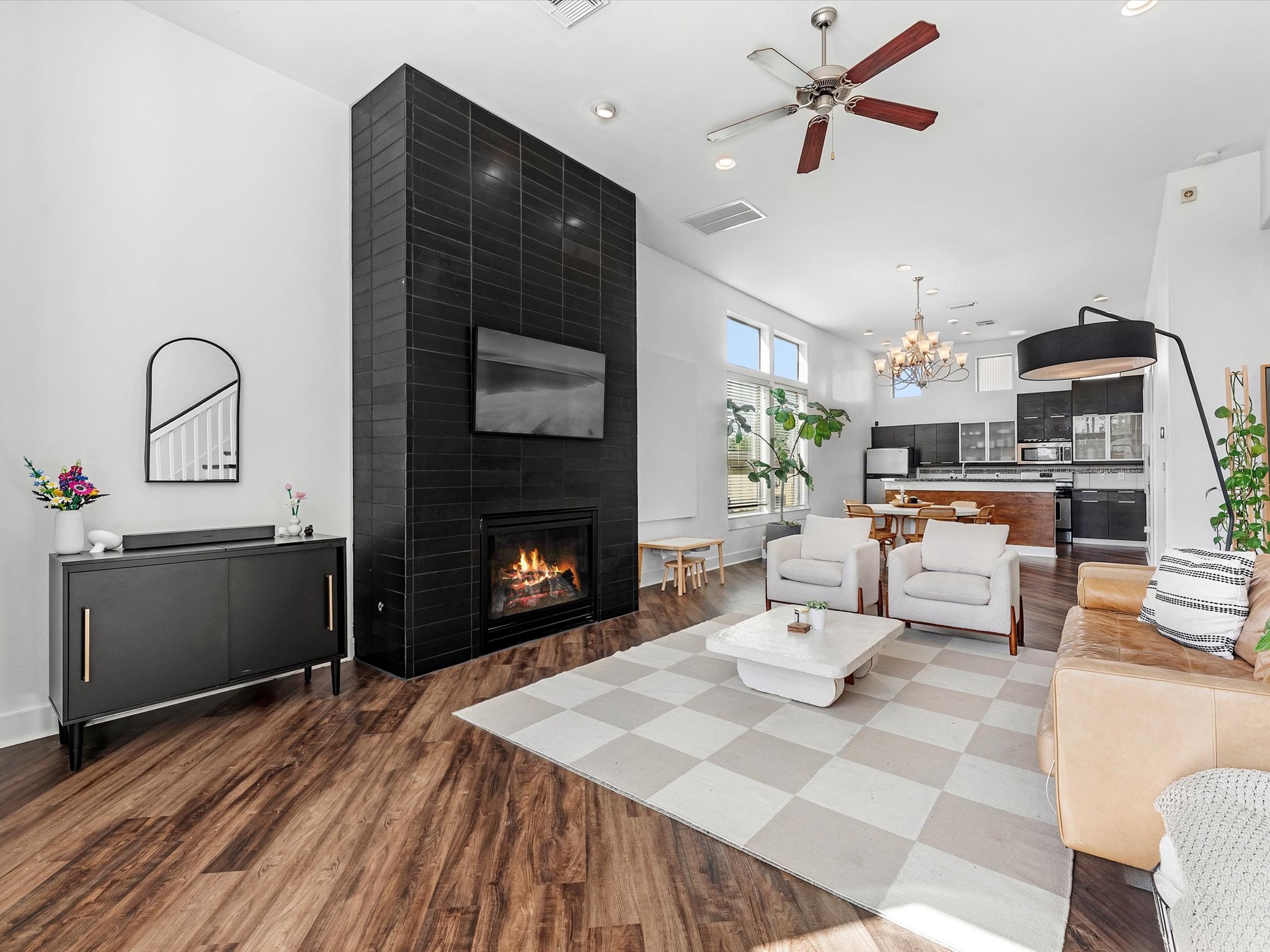 3421 Gillespie Street Houston, TX 77020 - Photo 13 of 34 a living room with furniture a fireplace and kitchen view