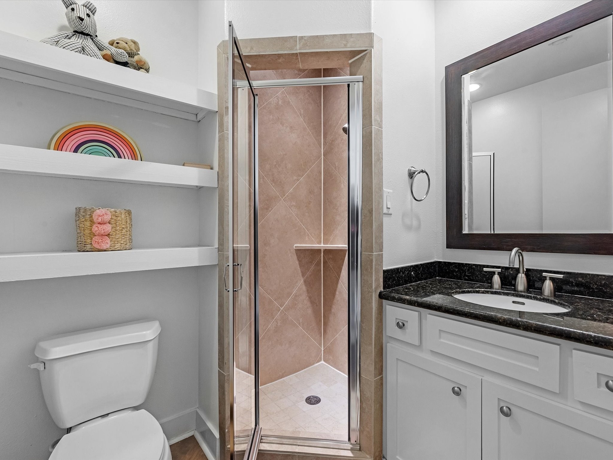 3421 Gillespie Street Houston, TX 77020 - Photo 30 of 34 a bathroom with a sink a toilet and a mirror