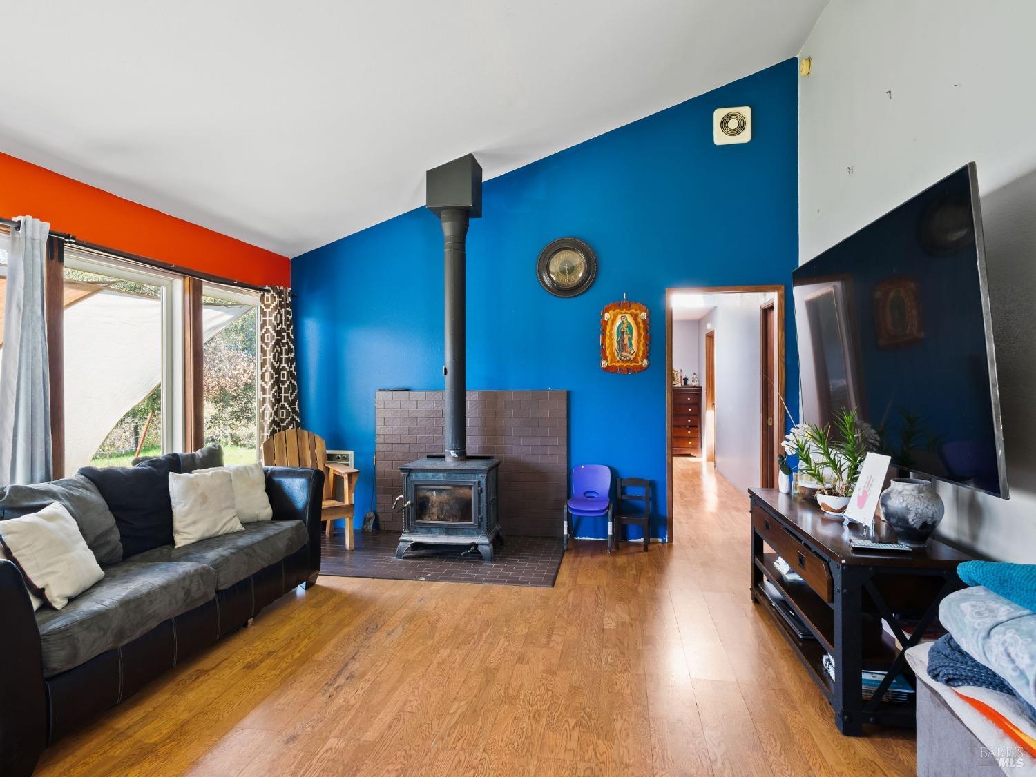 1550 Guntly Road Philo, CA 95466 - Photo 13 of 23 a living room with furniture and a flat screen tv