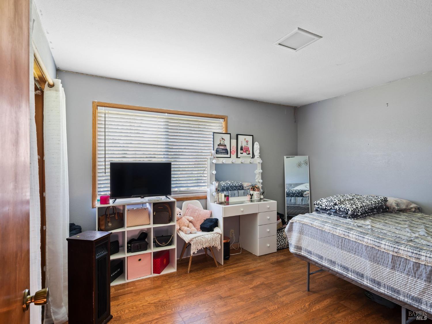 1550 Guntly Road Philo, CA 95466 - Photo 16 of 23 a bedroom with a bed and a flat screen tv