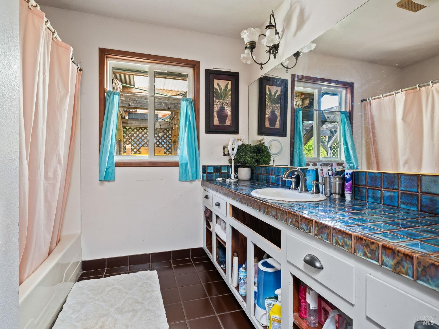 1550 Guntly Road Philo, CA 95466 - Photo 19 of 23 a kitchen with stainless steel appliances granite countertop a sink a stove a window and a dining table