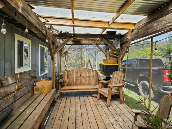 a view of a chairs in wooden deck