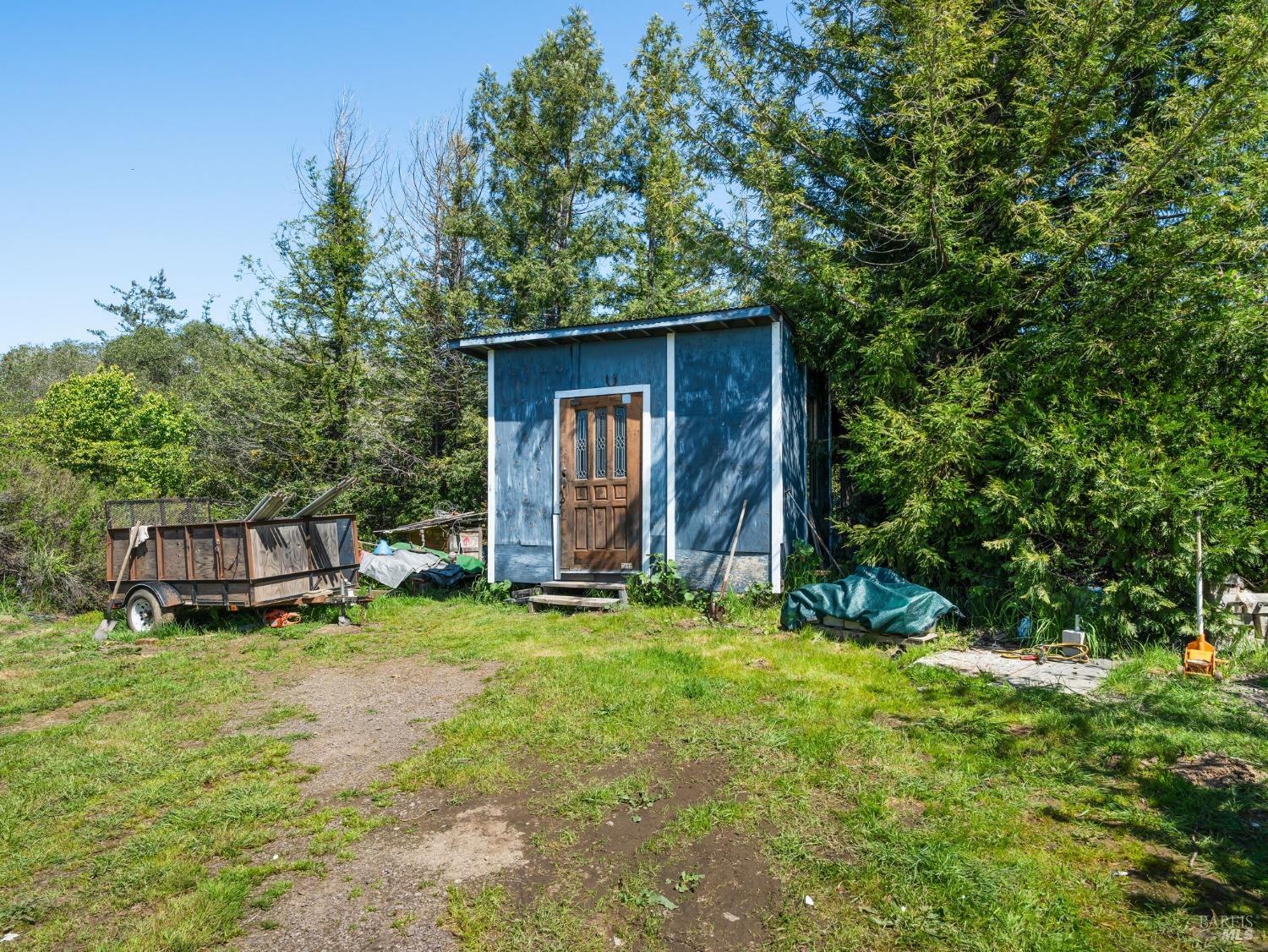 1550 Guntly Road Philo, CA 95466 - Photo 21 of 23 a view of a house with backyard and sitting area