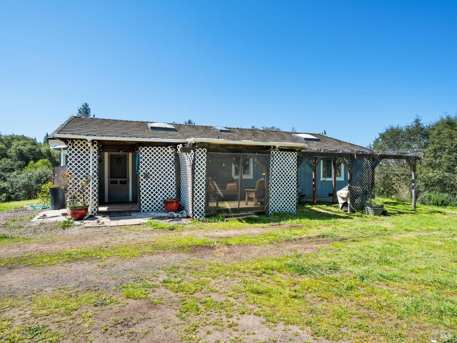1550 Guntly Road Philo, CA 95466 - Photo 9 of 23 a view of a house with a yard and sitting area