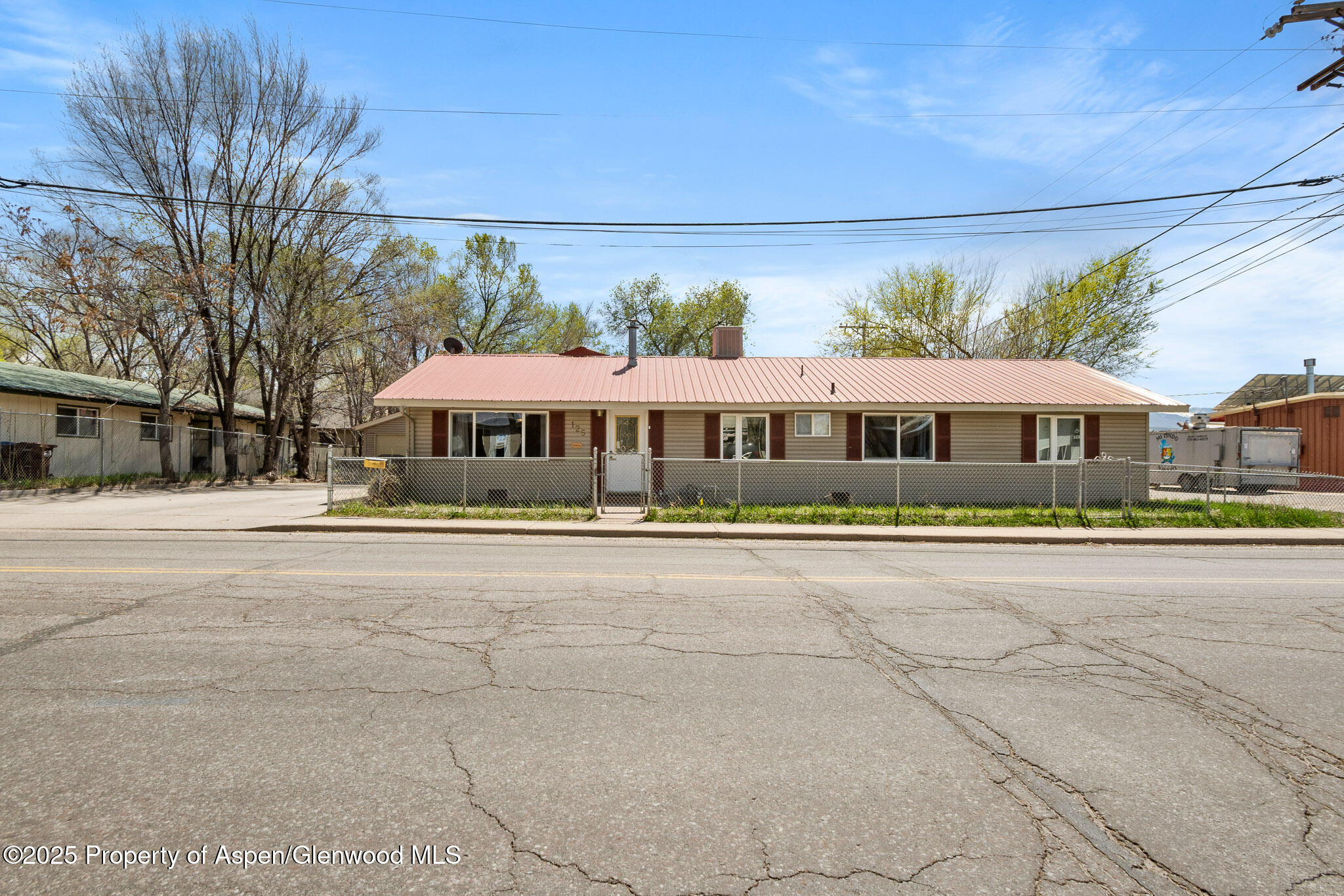 125 East 9th Street Rifle, CO 81650 - Photo 1 of 29 a front view of a building with street view