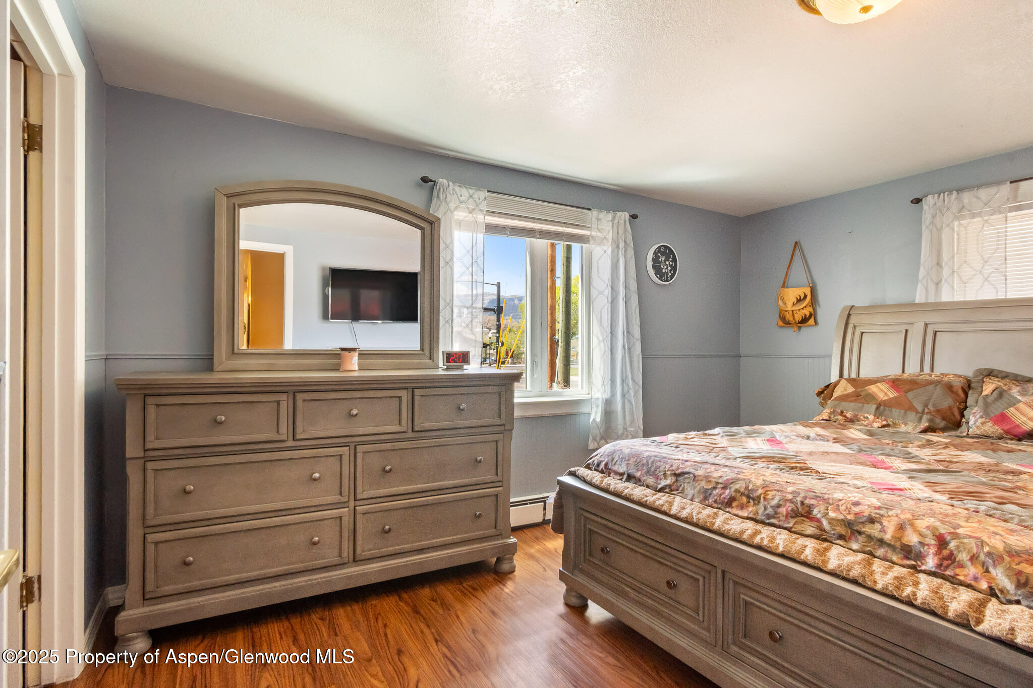125 East 9th Street Rifle, CO 81650 - Photo 17 of 29 a bedroom with a large bed and a window
