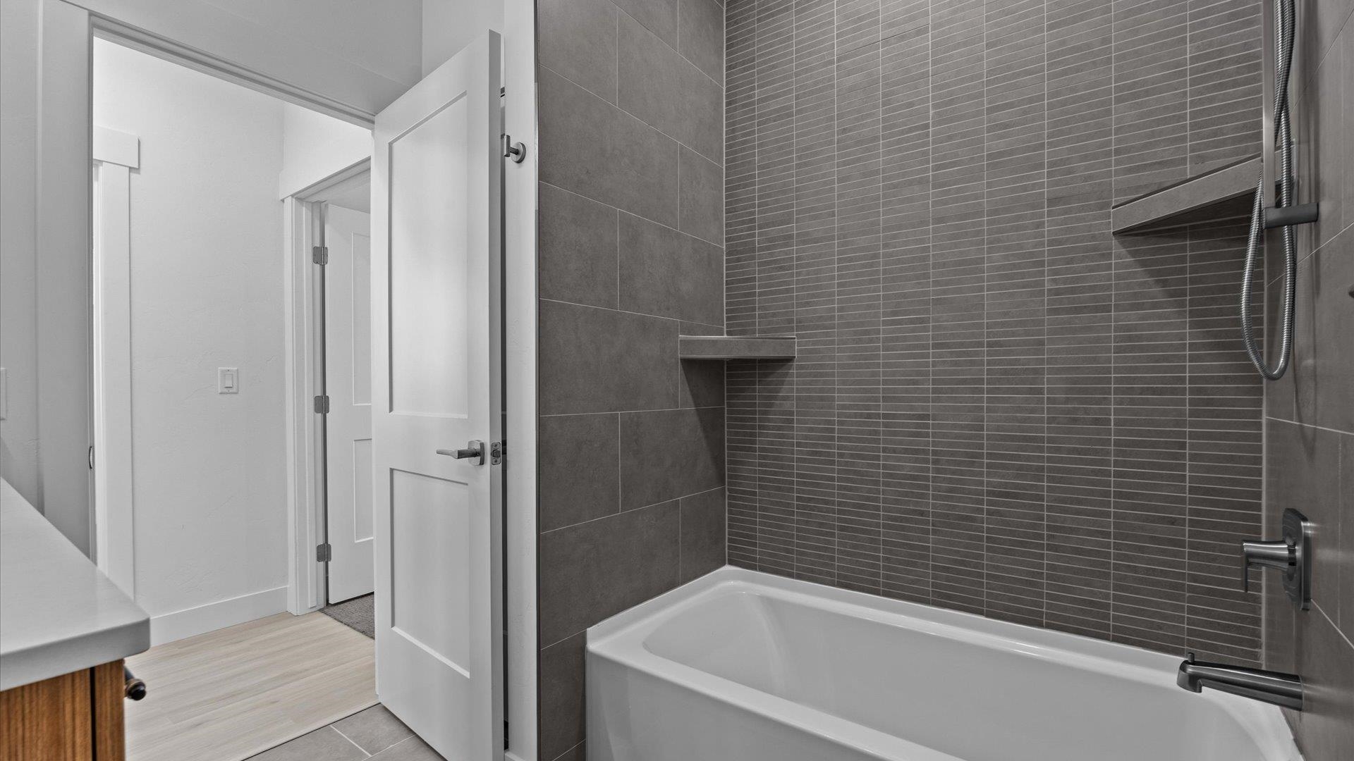 2045 Caleb Street Grand Junction, CO 81507 - Photo 33 of 42 a bathroom with a bathtub and shower