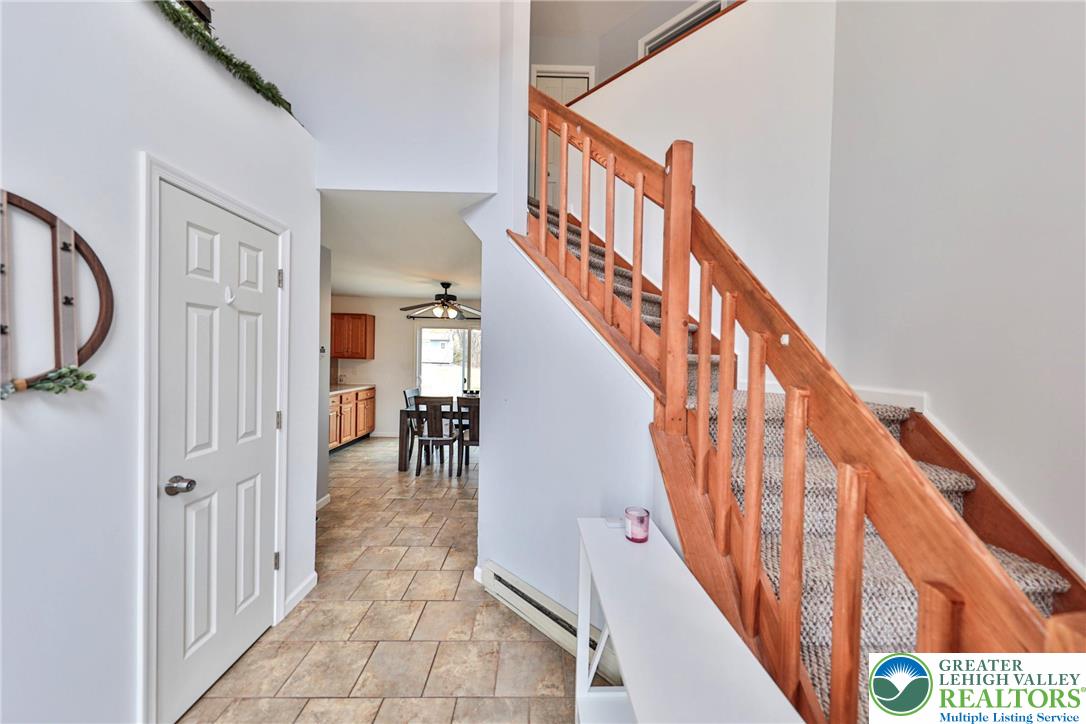 2260 Reo Drive Effort, PA 18330 - Photo 3 of 40 a view of staircase with lots of frames on wall and a window