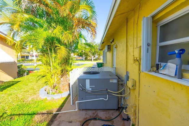 a view of a swimming pool with a yard