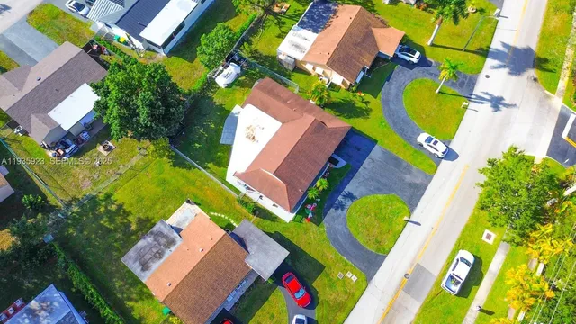 an aerial view of a house with a swimming pool
