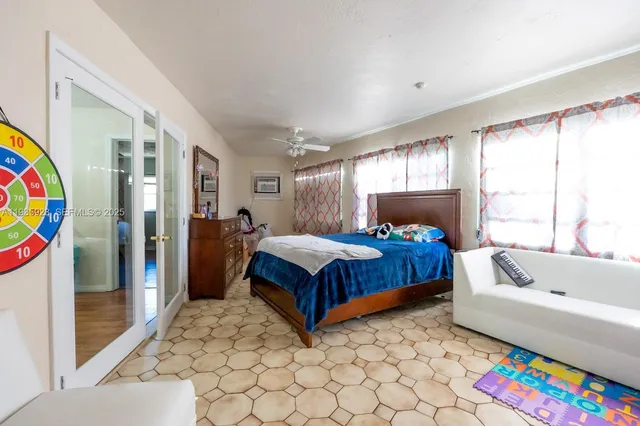 a bedroom with a bed and a couch