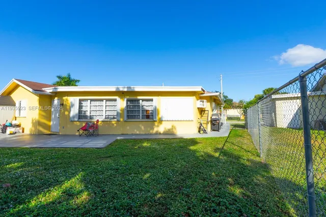 a view of yard with swimming pool