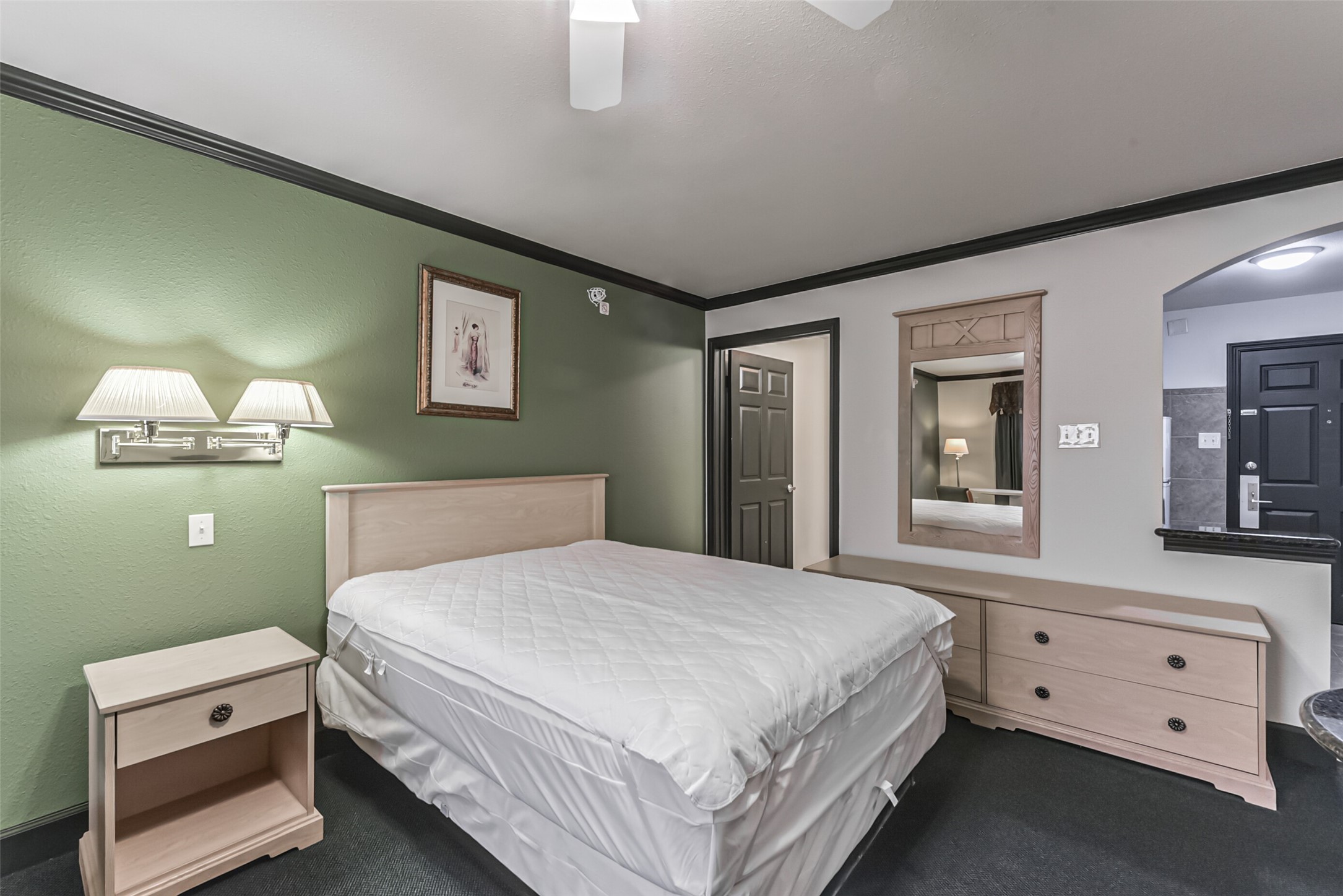 1025 Swanson Street, Unit 311 Houston, TX 77030 - Photo 15 of 26 a bedroom with a bed and a night stand