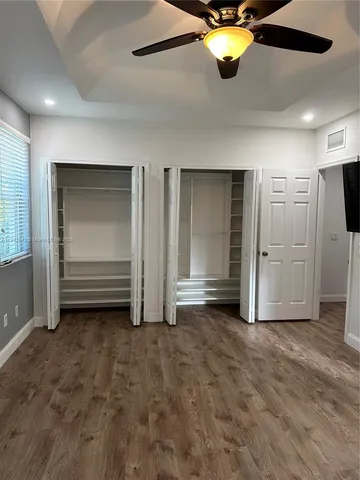 a bathroom with a toilet sink and shower
