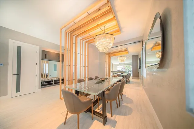 a view of a dining room with furniture and a window