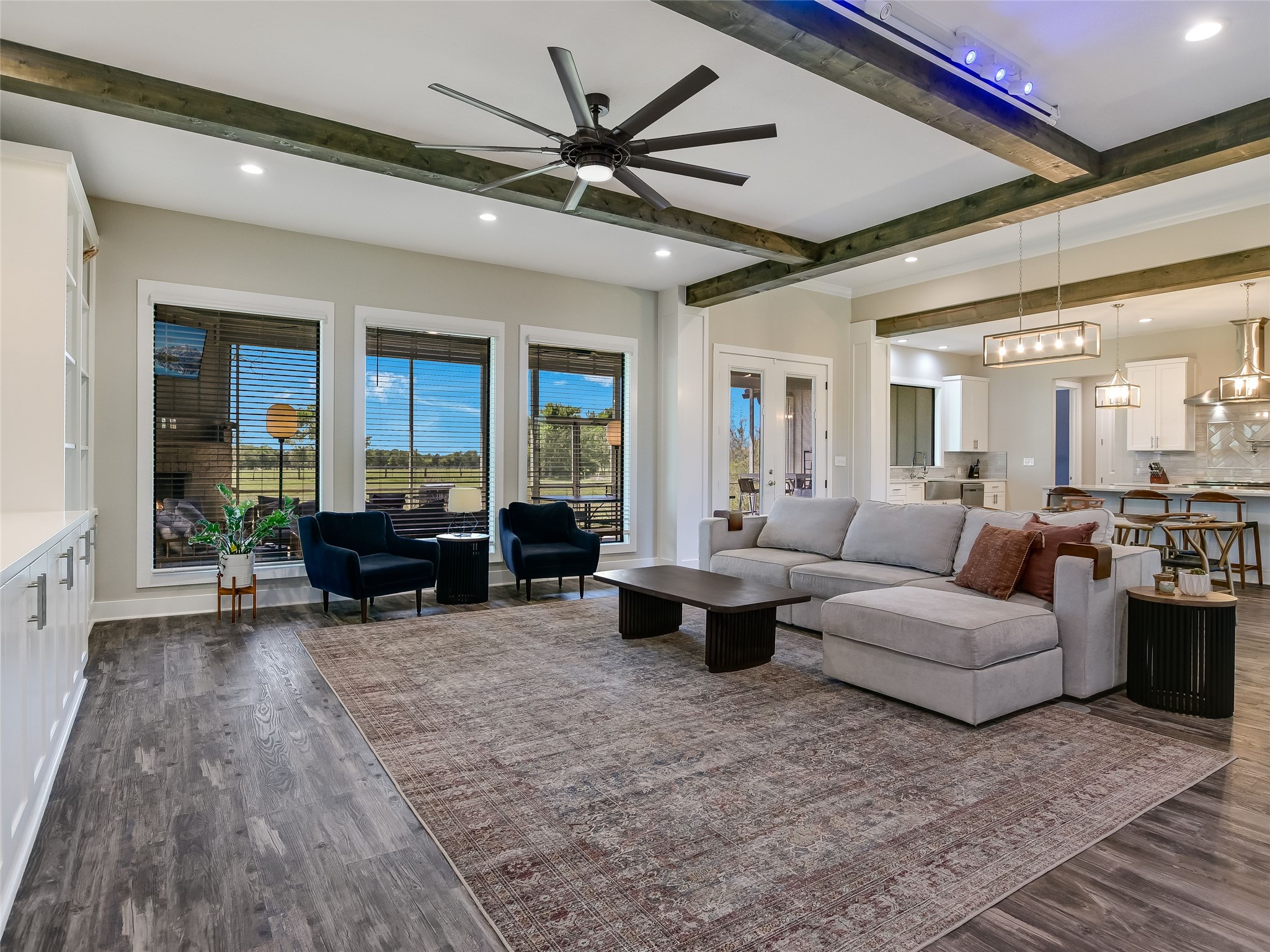 19819 Lockwood Road Manor, TX 78653 - Photo 10 of 29 With expansive views of open sky and natural surroundings, the living room invites quiet mornings, golden-hour sunsets, and a deeper connection to the land.