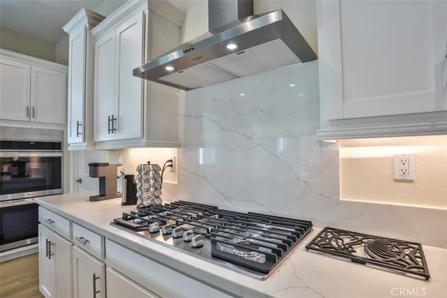 a kitchen with sink and cabinets