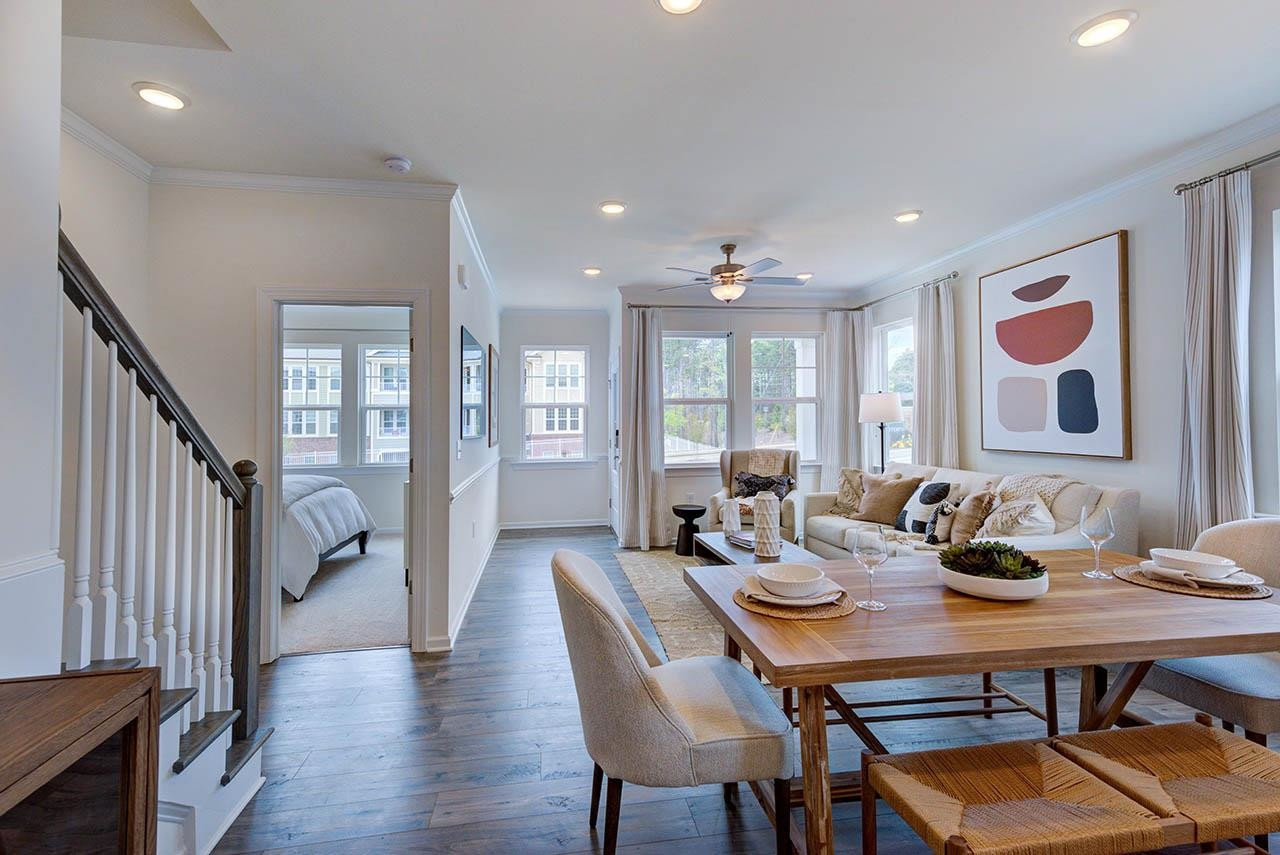 1714 Wimberly Road Apex, NC 27523 - Photo 15 of 45 a view of a dining room with furniture window and wooden floor