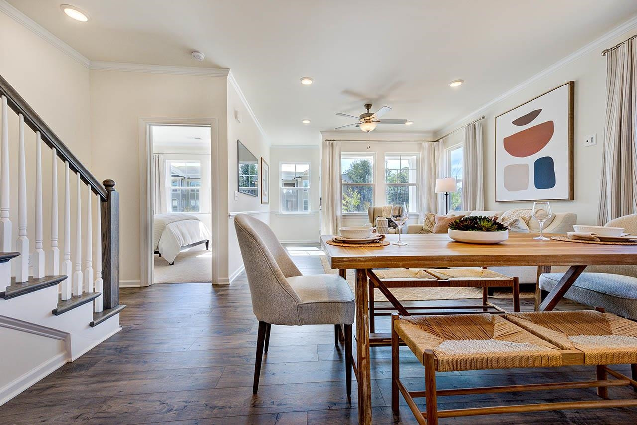 1714 Wimberly Road Apex, NC 27523 - Photo 16 of 45 a room with a table chairs and wooden floor