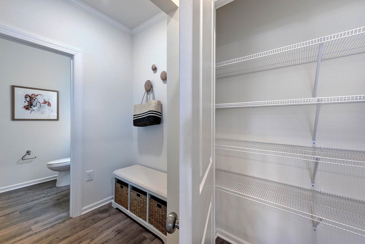 1714 Wimberly Road Apex, NC 27523 - Photo 18 of 45 a bathroom with a toilet and a sink