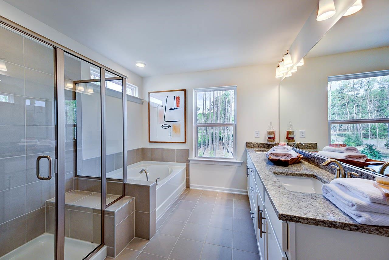 1714 Wimberly Road Apex, NC 27523 - Photo 24 of 45 a bedroom with furniture a flat screen tv and a large window