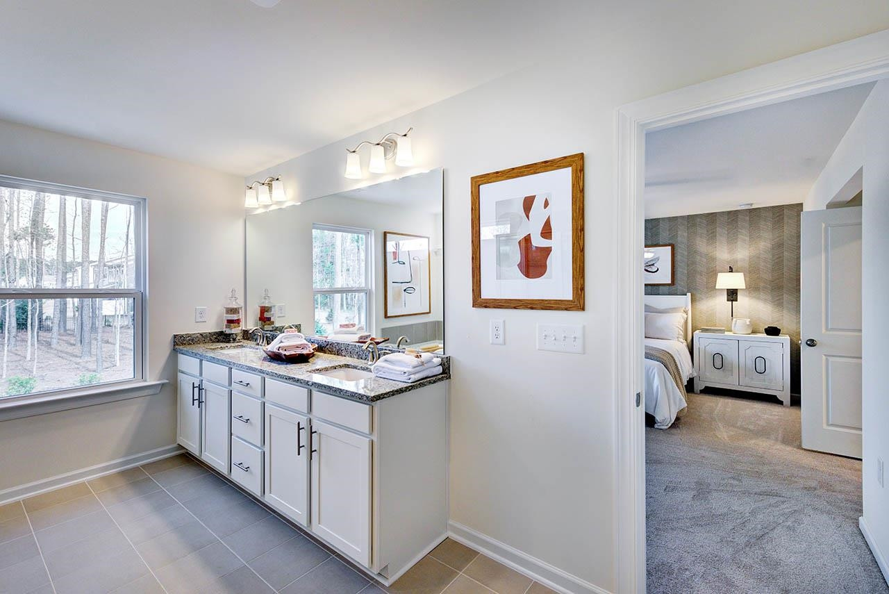 1714 Wimberly Road Apex, NC 27523 - Photo 30 of 45 a kitchen with stainless steel appliances a stove refrigerator and sink