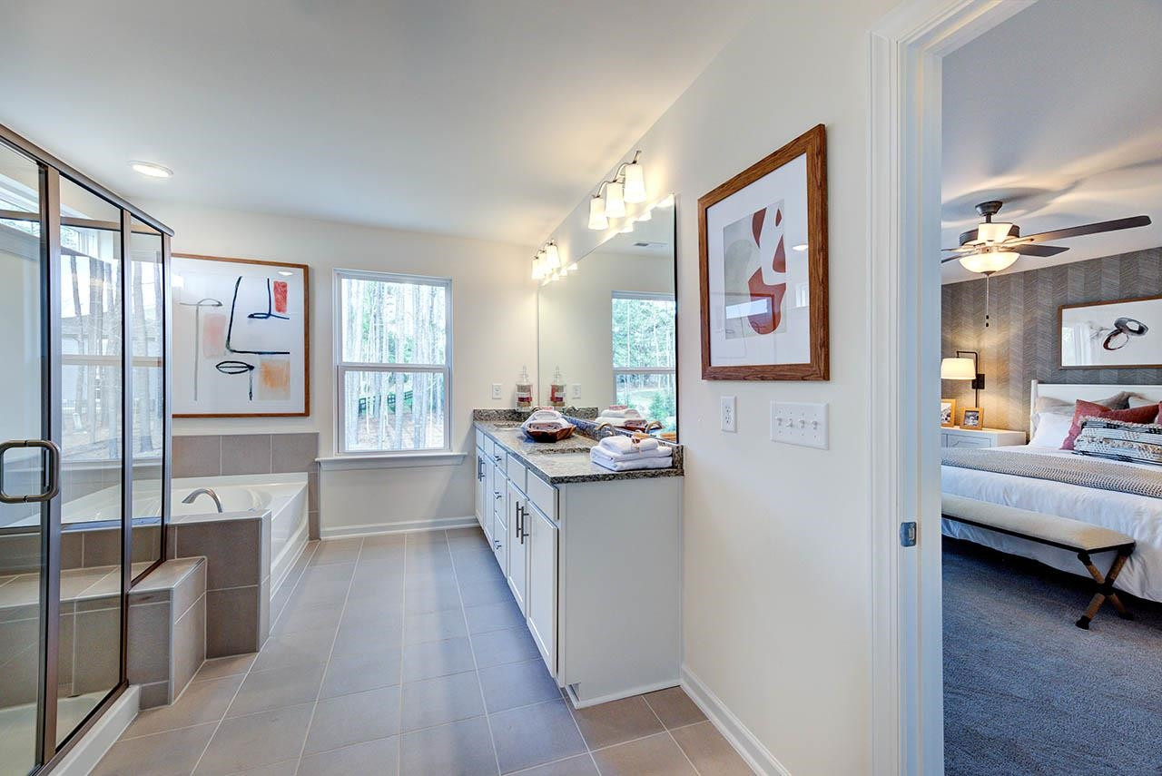 1714 Wimberly Road Apex, NC 27523 - Photo 31 of 45 a living room with stainless steel appliances furniture and a kitchen view