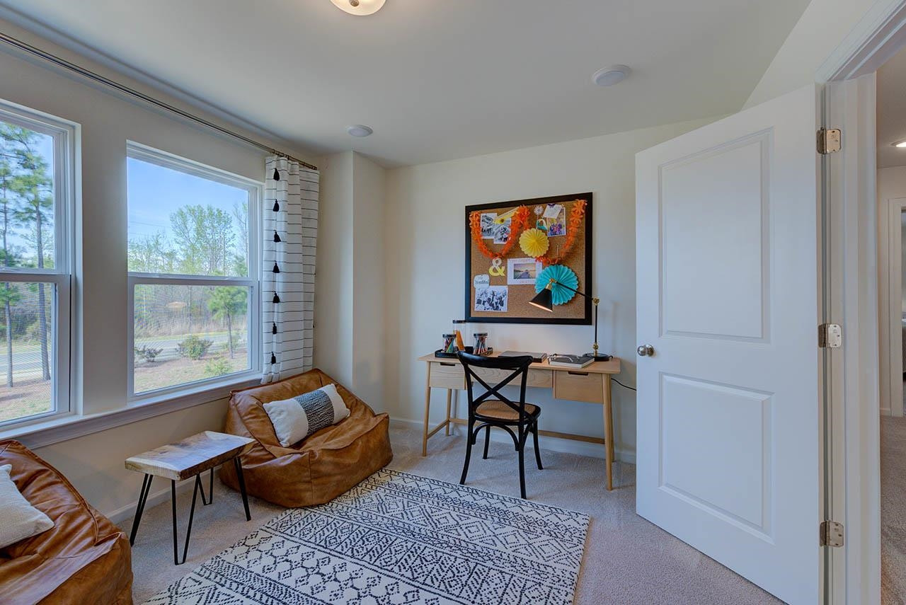 1714 Wimberly Road Apex, NC 27523 - Photo 34 of 45 a living room with furniture and a window