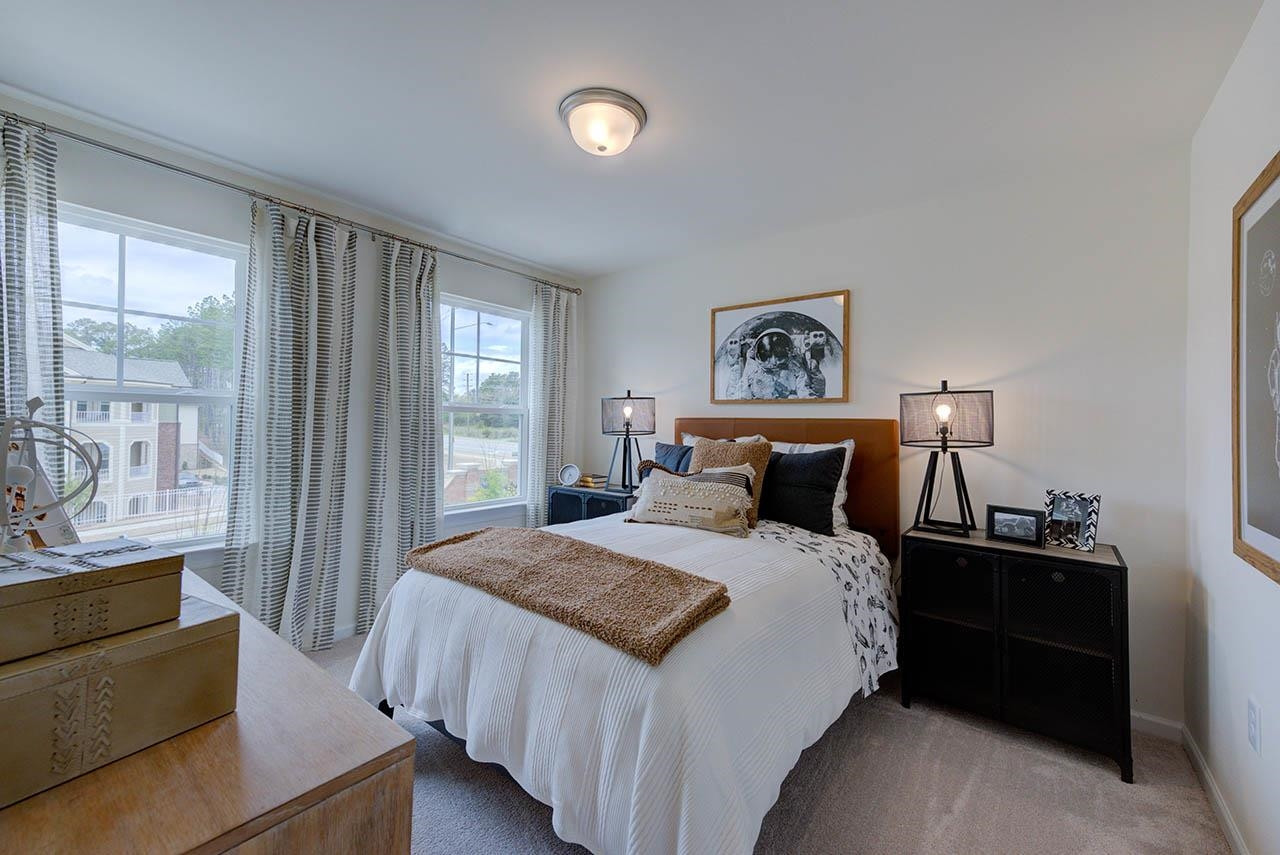 1714 Wimberly Road Apex, NC 27523 - Photo 45 of 45 a bedroom with a bed and a night stand