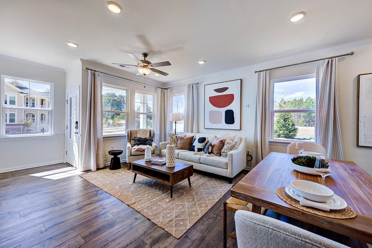 1714 Wimberly Road Apex, NC 27523 - Photo 5 of 45 a living room with furniture and wooden floor