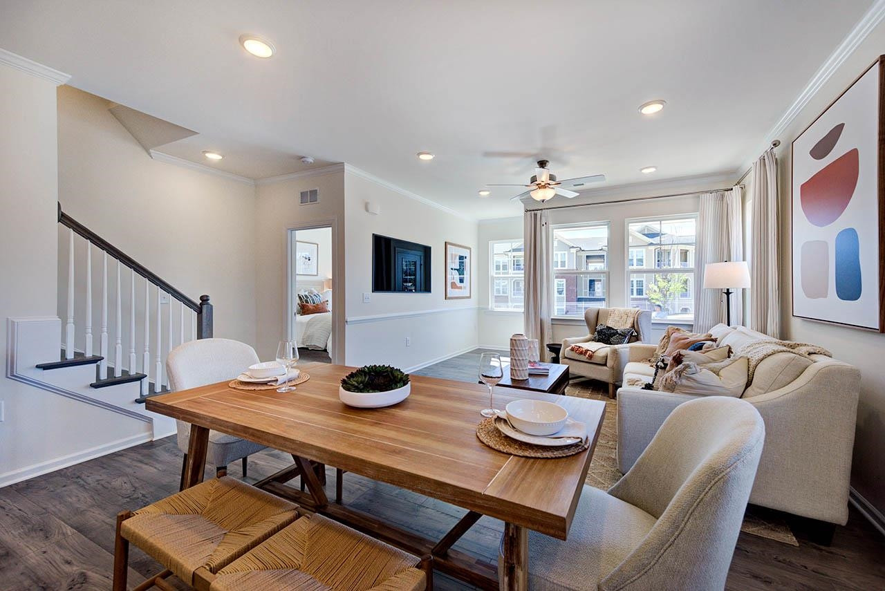 1714 Wimberly Road Apex, NC 27523 - Photo 6 of 45 a view of a dining room with furniture and wooden floor