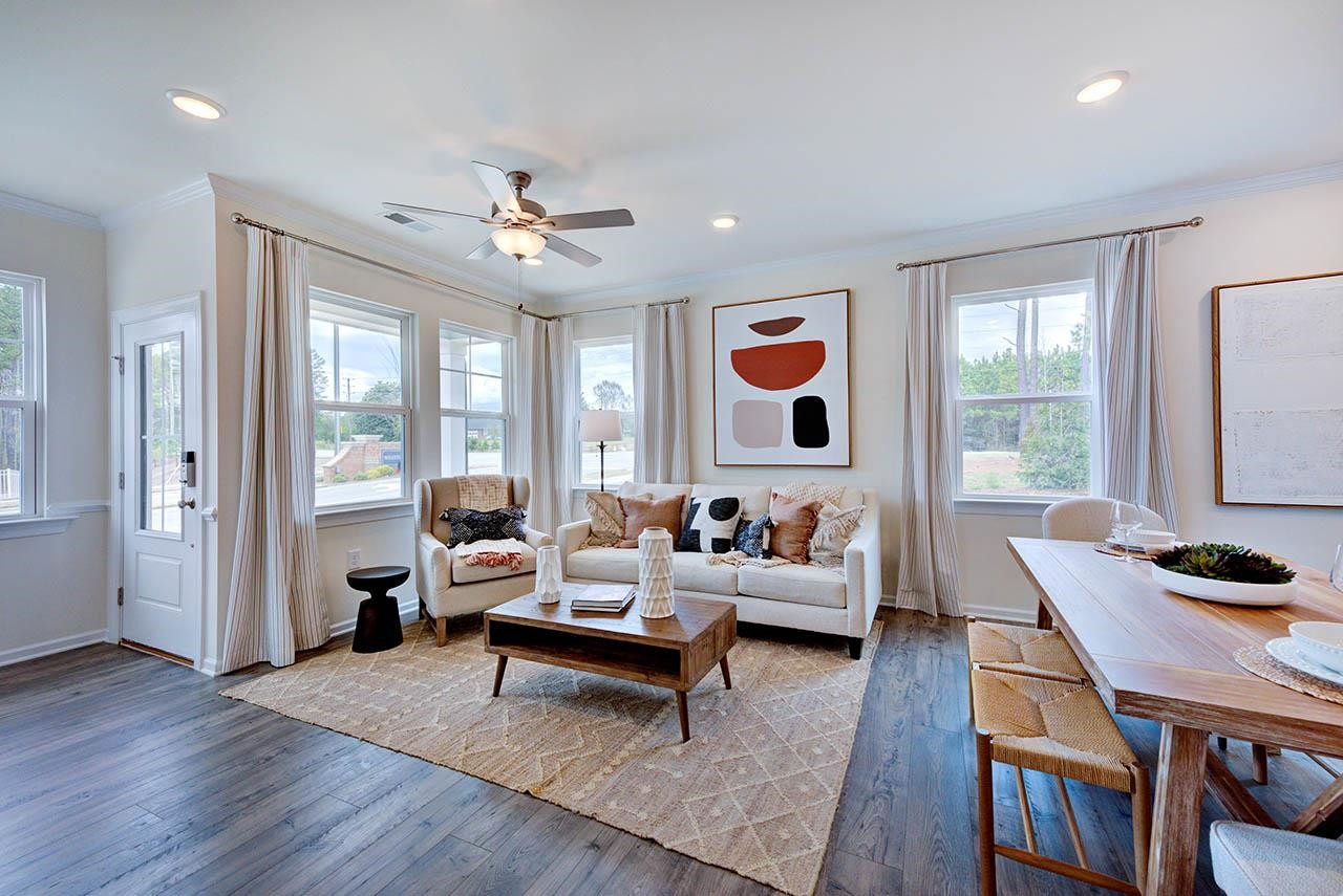 1714 Wimberly Road Apex, NC 27523 - Photo 9 of 45 a living room with furniture and wooden floor