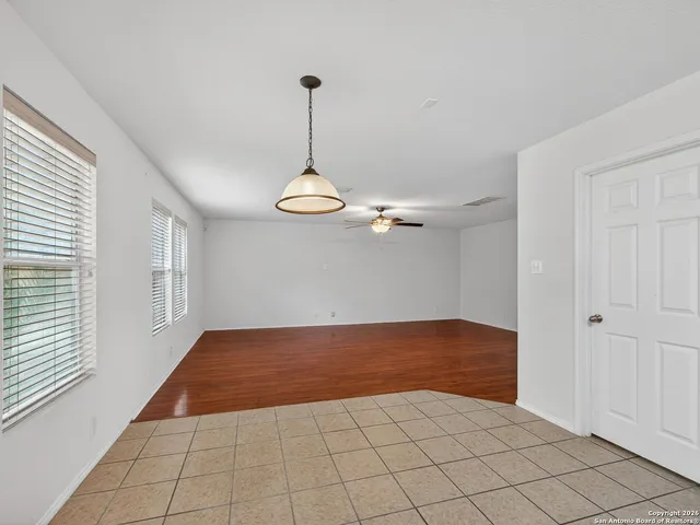 a view of empty room with windows