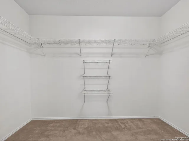 a view of a room with racks on the wall