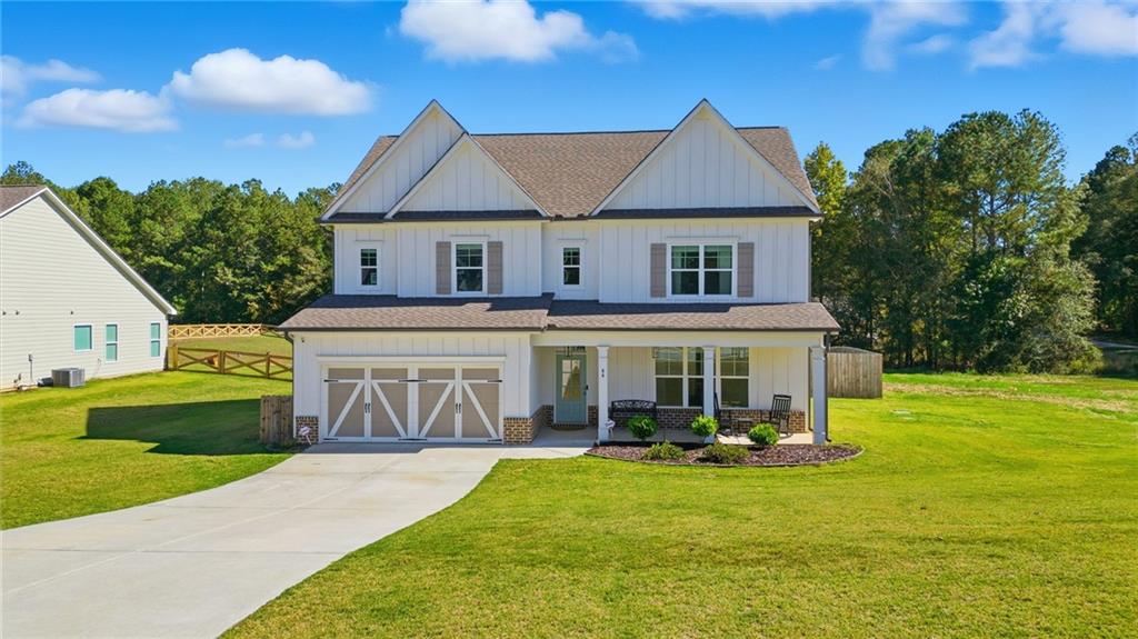 64 Dunagan Court Winder, GA 30680 - Photo 1 of 1 a front view of a house with garden