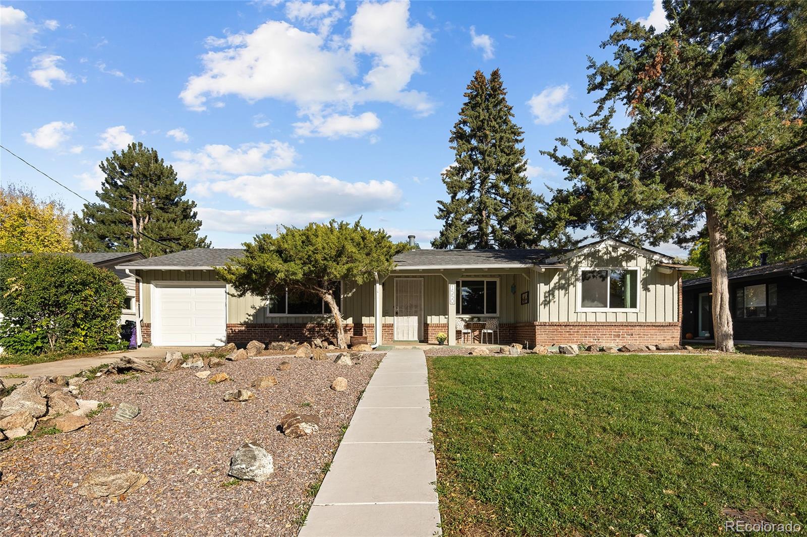 1550 South Forest Street Denver, CO 80222 - Photo 1 of 38 a front view of house with yard and trees around