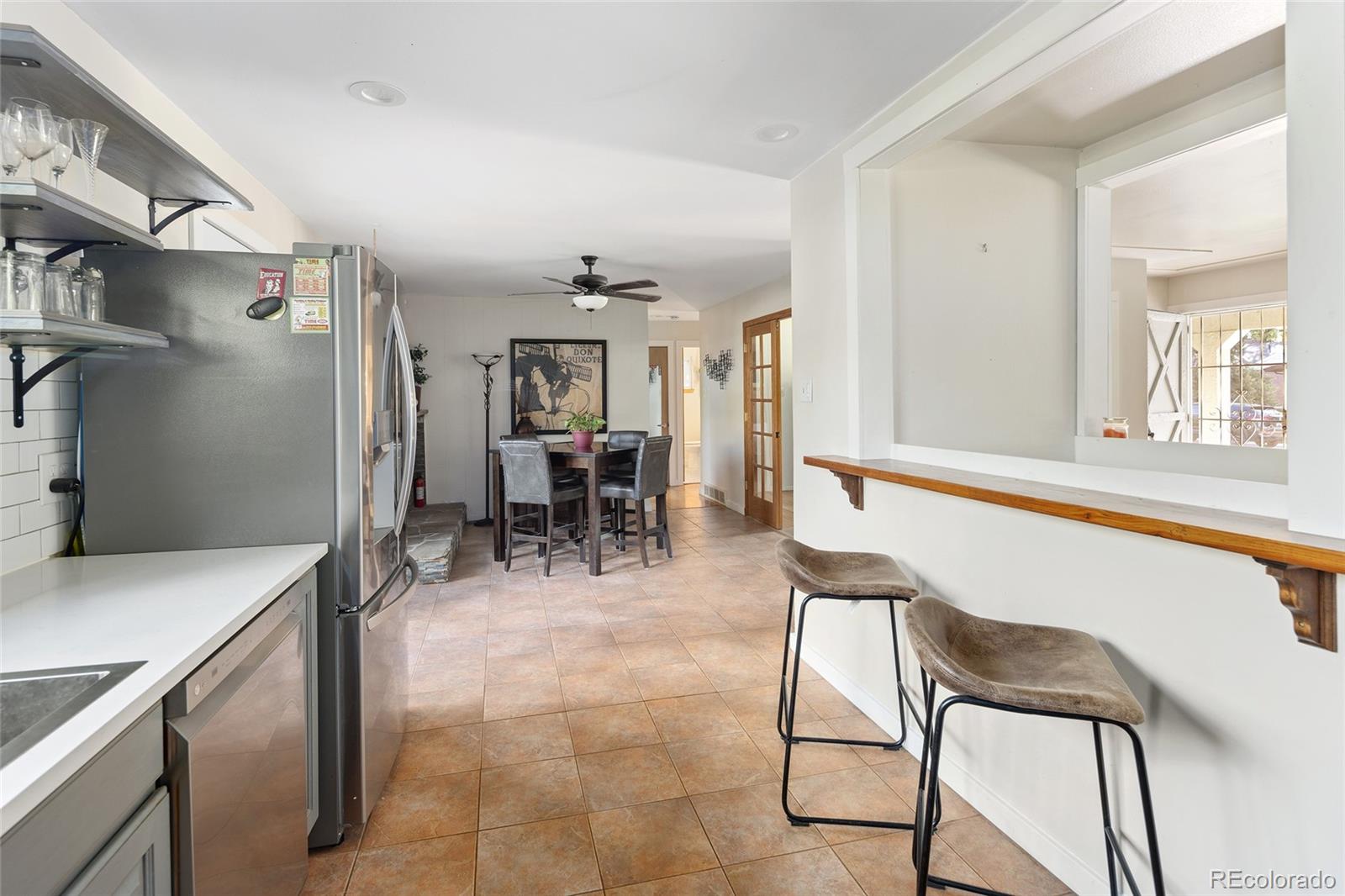 1550 South Forest Street Denver, CO 80222 - Photo 12 of 38 a view of kitchen with furniture and a potted plant