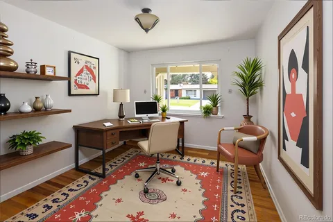 a workspace with furniture and window