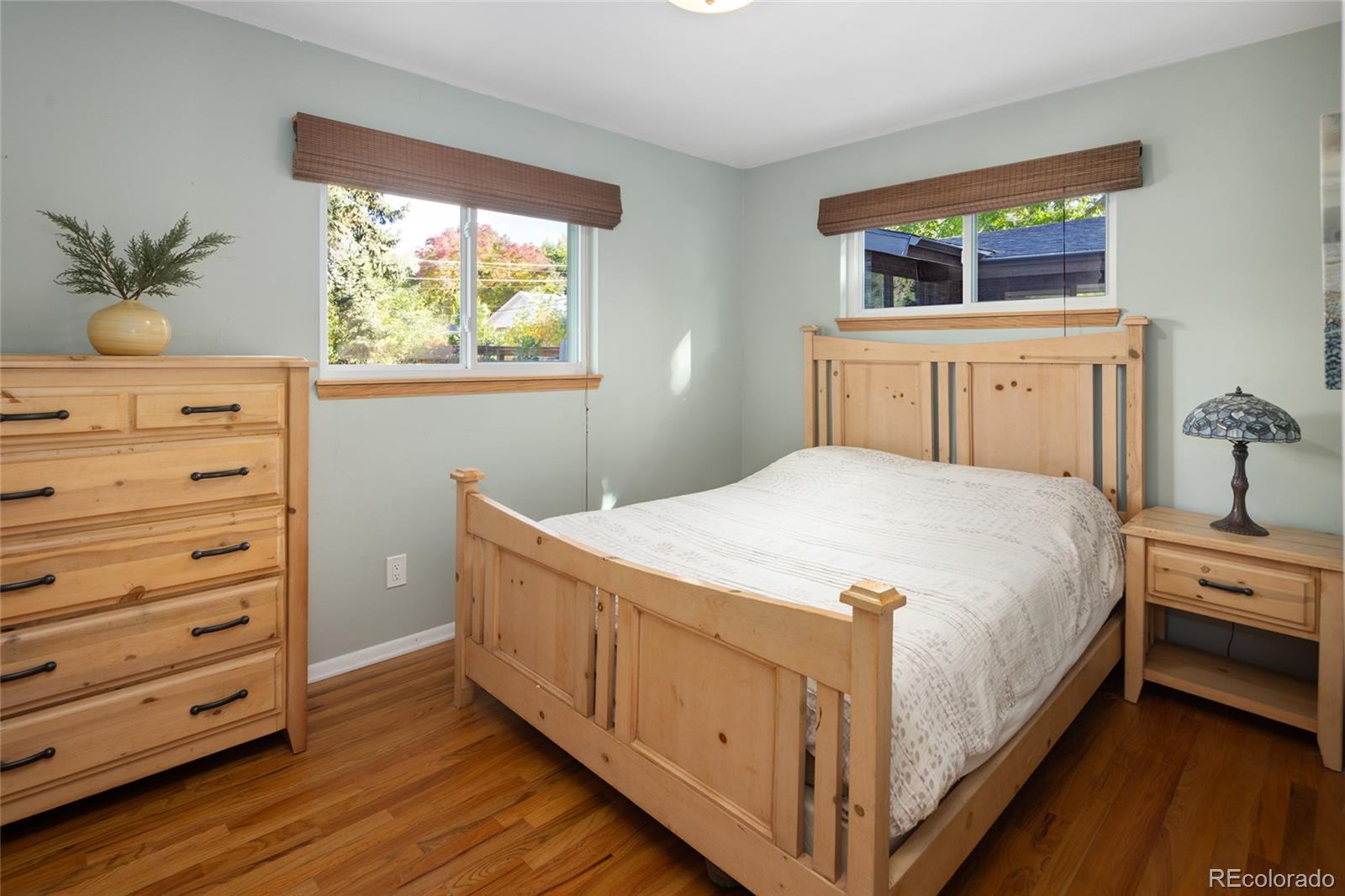 1550 South Forest Street Denver, CO 80222 - Photo 20 of 38 a spacious bedroom with a bed and a window
