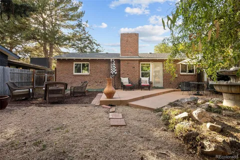 a view of a backyard with a car parked in it