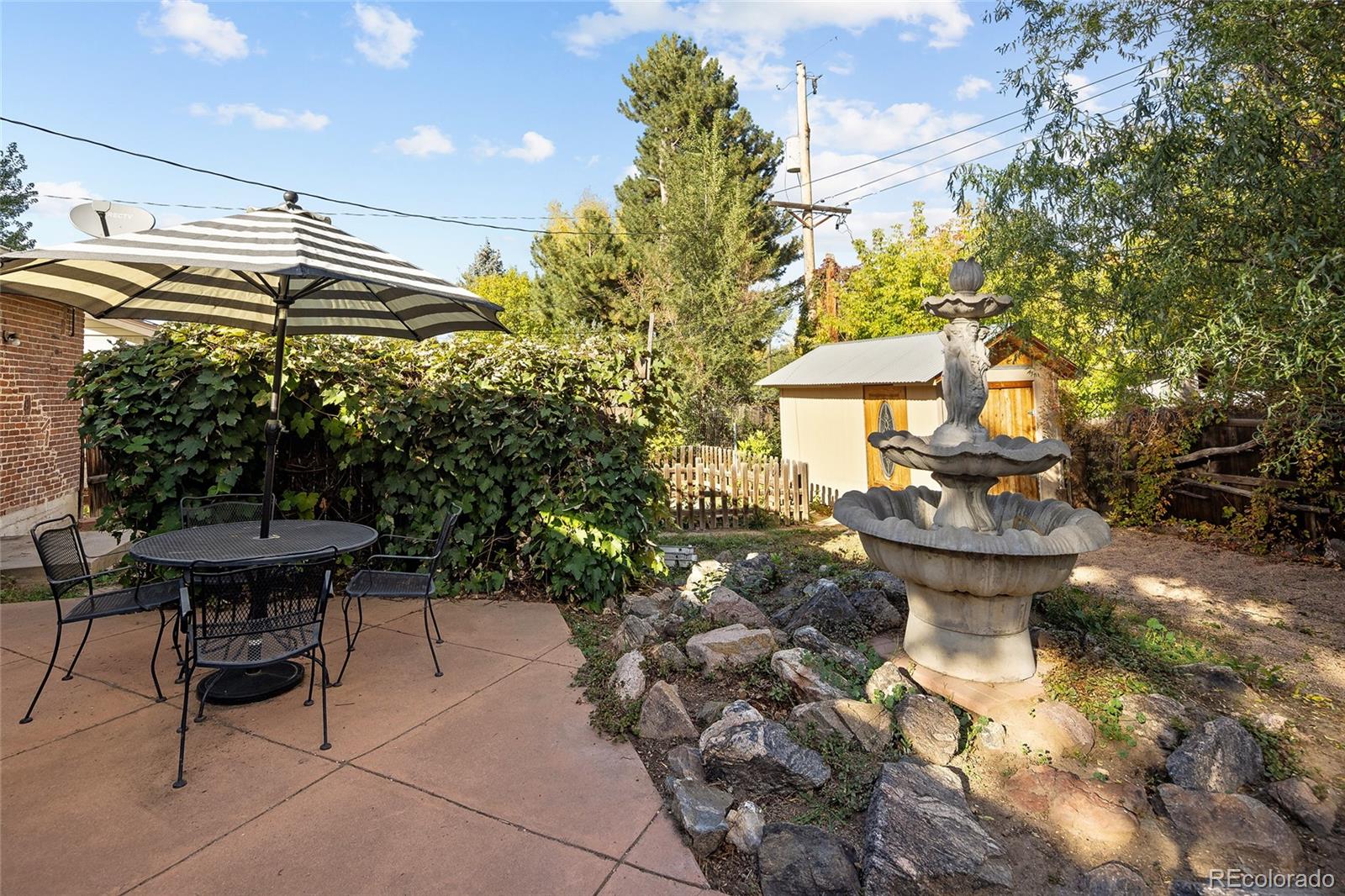 1550 South Forest Street Denver, CO 80222 - Photo 24 of 38 a view of a patio with table and chairs and potted plants