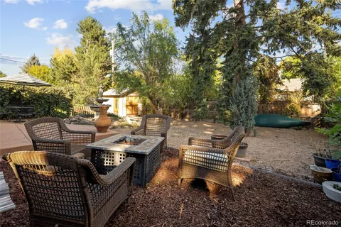 a view of a backyard with sitting area