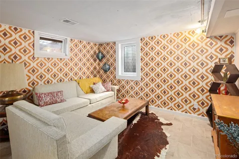 a living room with furniture and a rug