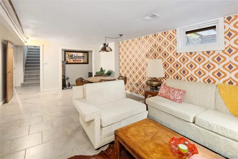 a living room with furniture and a couch