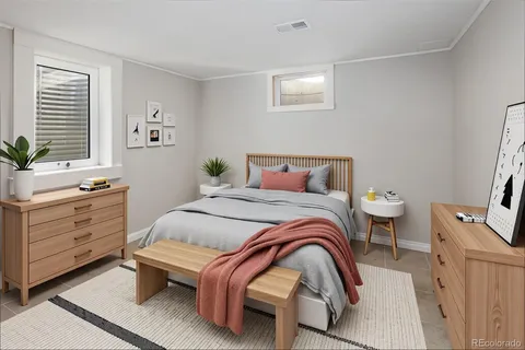 a bedroom with a bed and a dresser